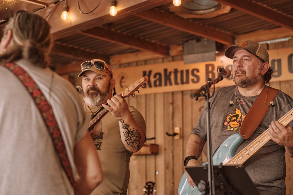 Stoney and Mark on stage looking at Vic