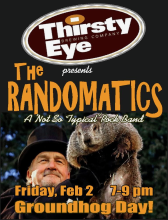 Man holding a groundhog with show information